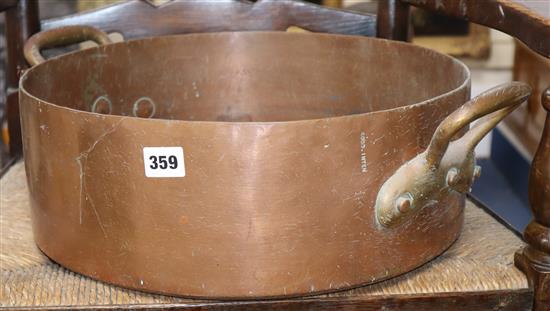 A Victorian copper two handled pan